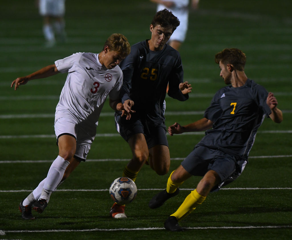 Ethan Blake, Jack Jenne and Preston Fancher compete for the ball